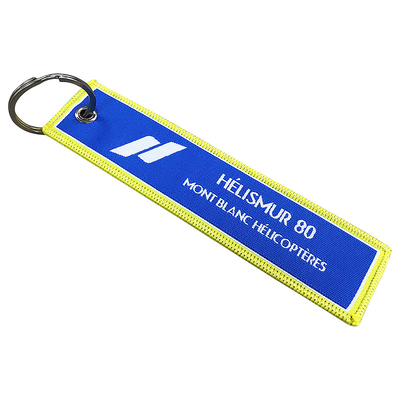 Envase de tela tejida de venta al por mayor de llavero de llave de llave de la etiqueta de jet de la etiqueta de costumbre bordado para la fiesta