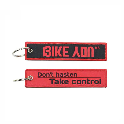 Cosida de carabinero personalizado bordado tejido jet tag portador de llaves águila pico negro correa de muñeca llavero de cordón