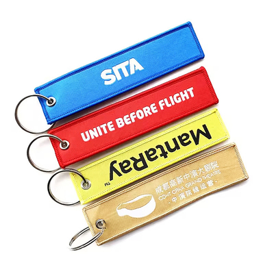 Regalos promocionales con logotipo personalizado Jet Tag Tejido bordado llavero de coche llavero tejido
