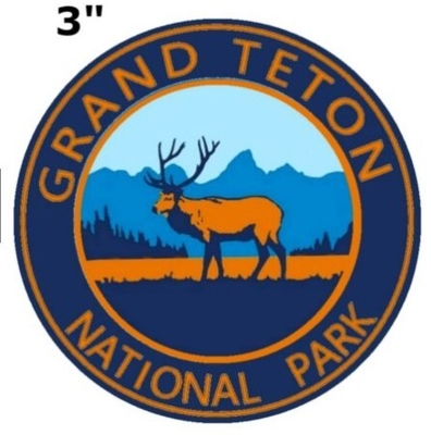 El parque nacional magnífico de Teton bordó el hierro del remiendo en/cose en el forro